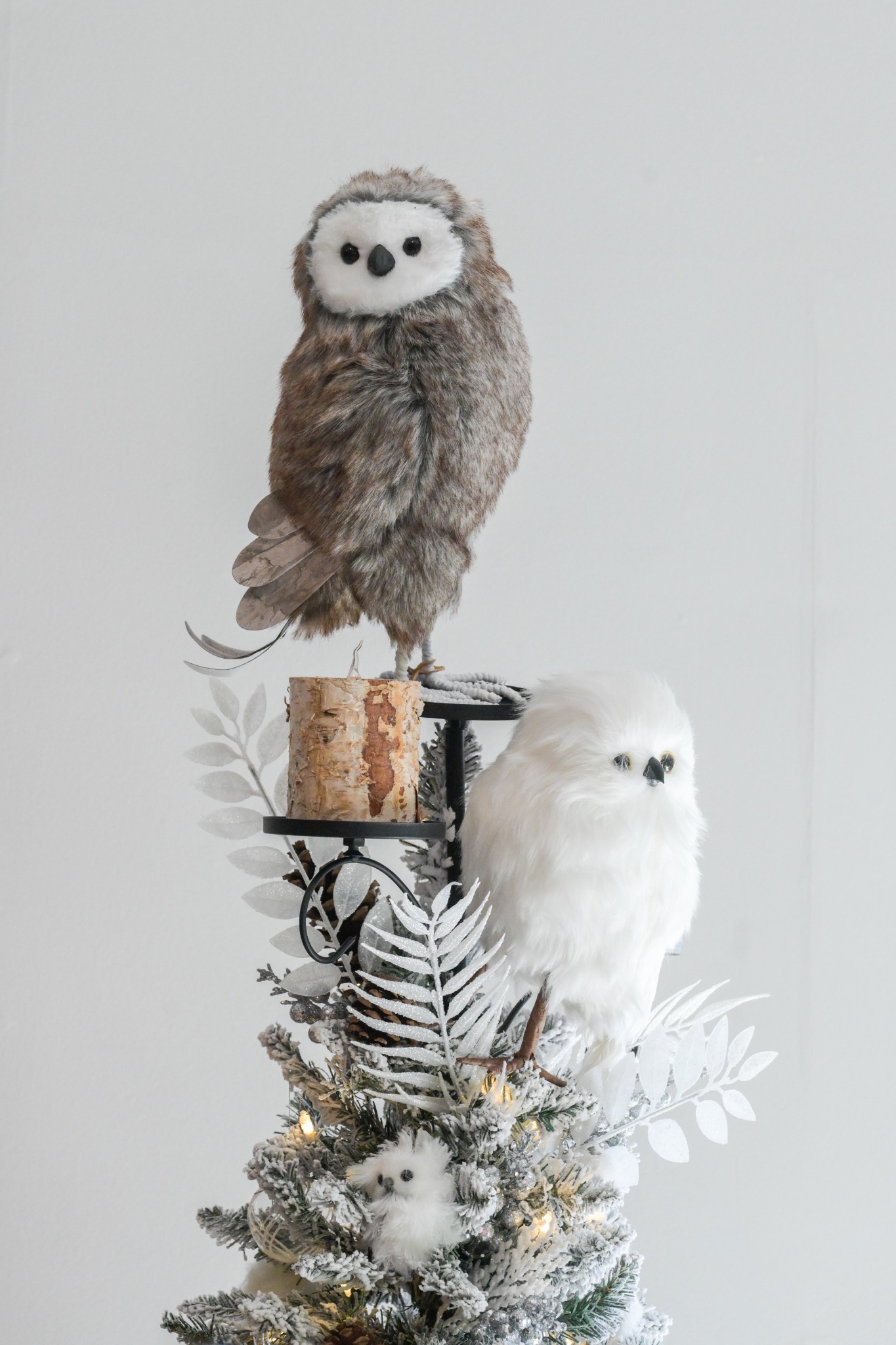 Owl-themed tree topper display
