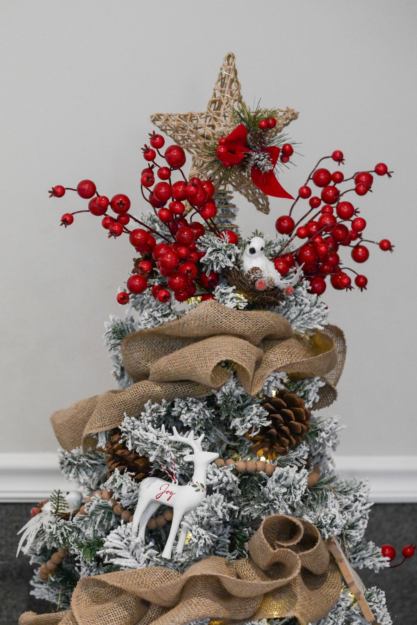 Rustic woodland tree topper with red berries