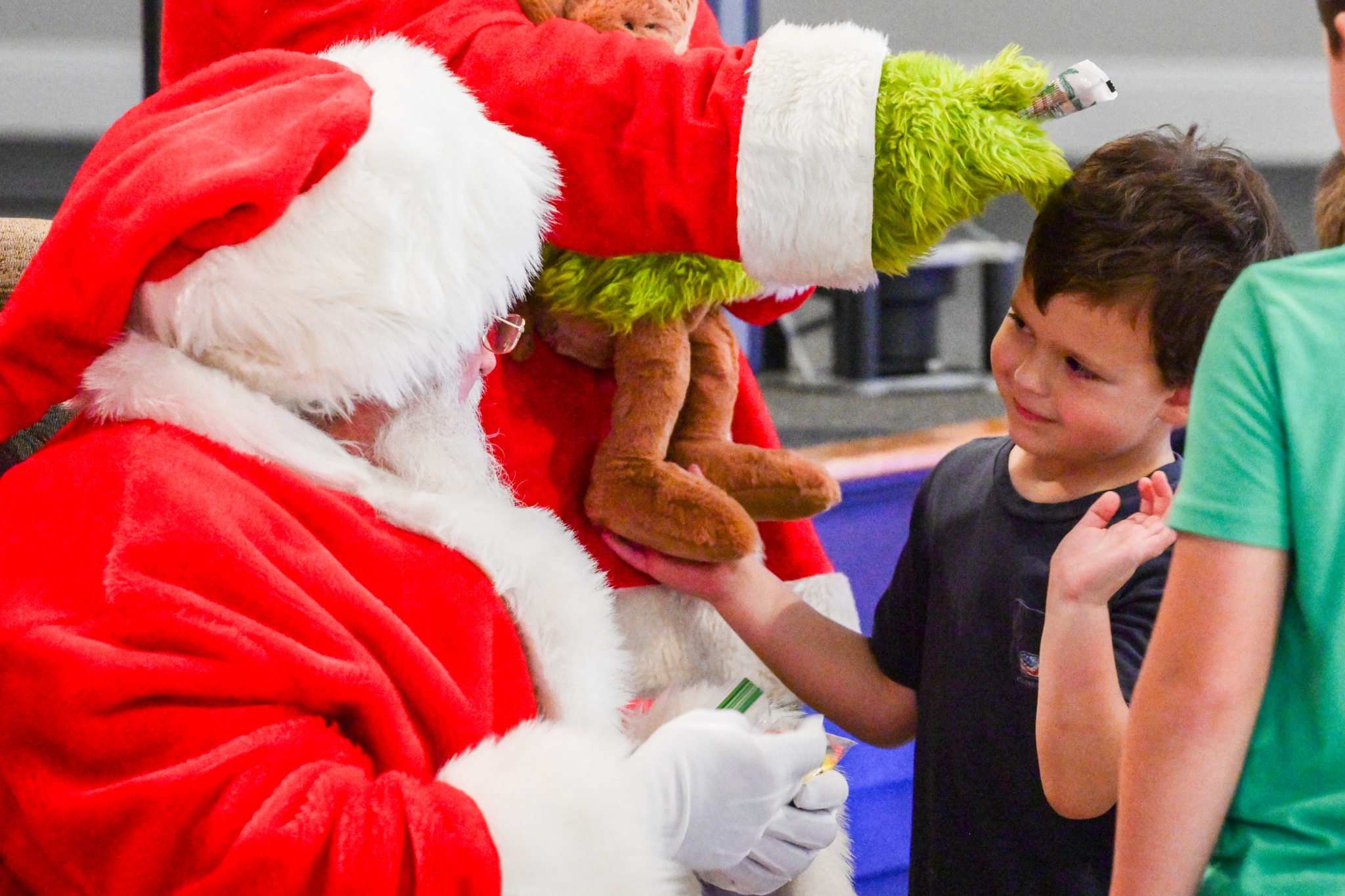Santa greeting a child at Festival of Trees